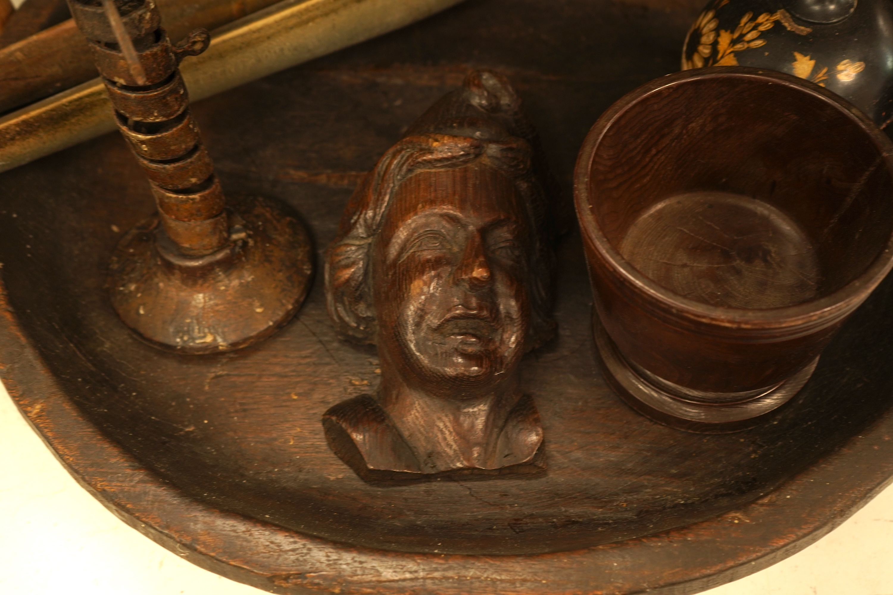 A quantity of mixed treen, including an inlaid box, carved head, large bowl etc and an 18th century French rat de cave wrought iron and treen candlestick. Bowl 49cm
